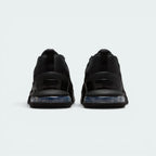 Focuses on the heavy-duty robust heel structure surrounding the visible Air window and the clean finish of the protective ankle collar.