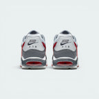 Focuses on the rear profile of both shoes, highlighting the classic grey nubuck-textured heel counters stitched with the Nike Air logo, positioned neatly above the sturdy grey heel frames and the translucent Gym Red Air window.