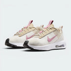Emphasising the locked-in padded collar and the professional "Elemental Pink" accents.