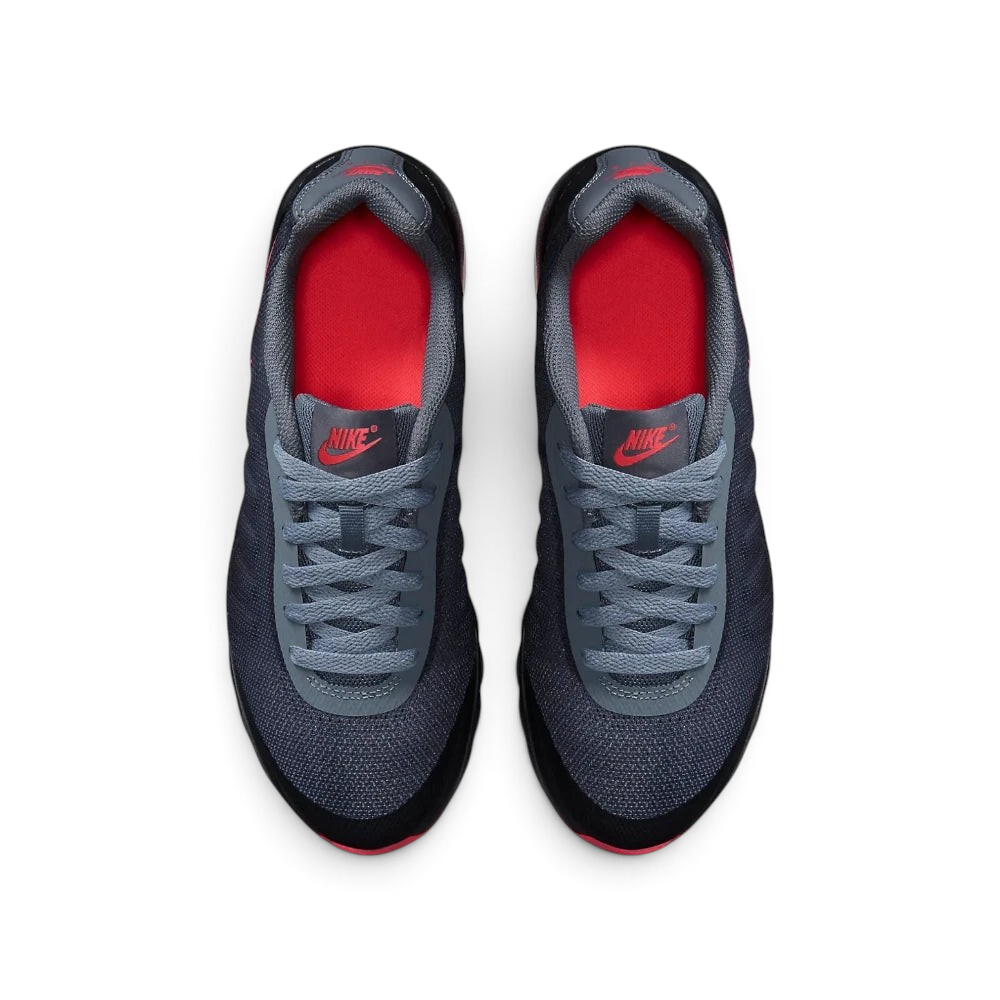 Top-Down View of Pair: Focuses on the Breathe Tech mesh texture and the symmetrical junior-specific lacing system.