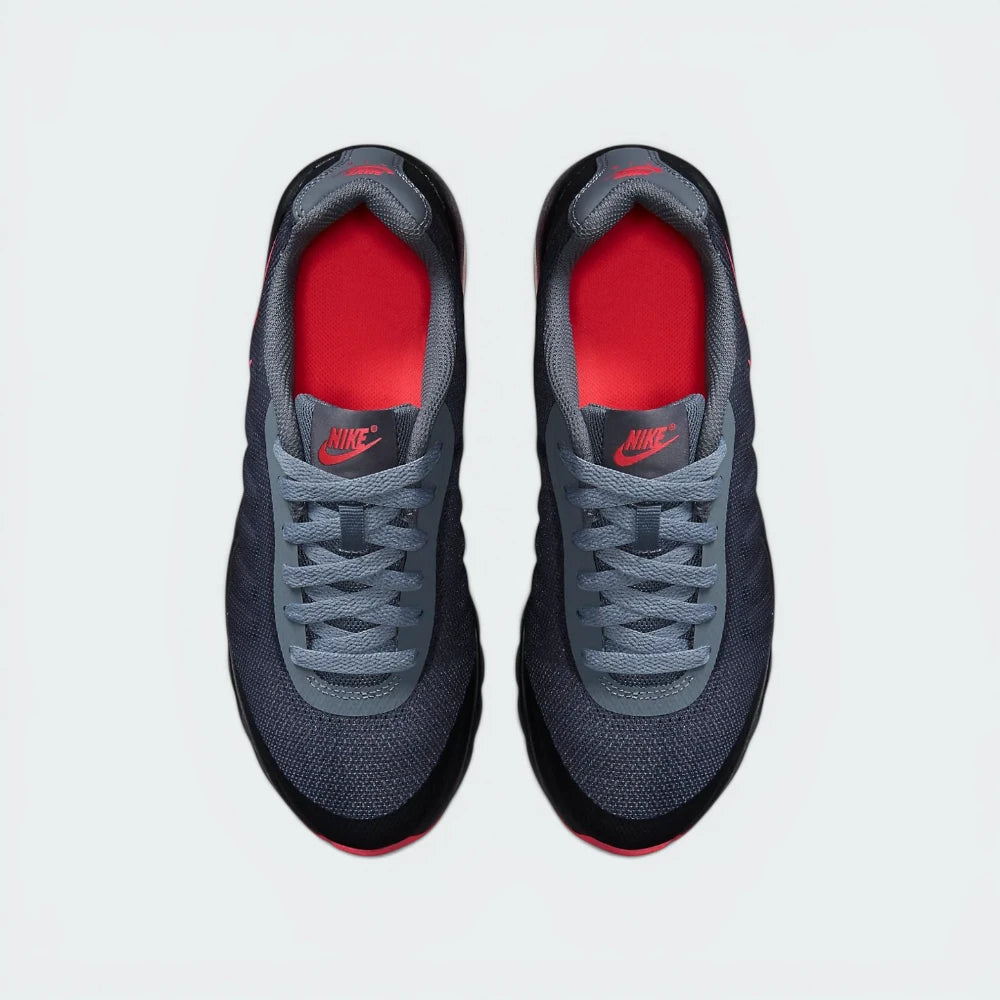 Top-Down View of Pair: Focuses on the Breathe Tech mesh texture and the symmetrical junior-specific lacing system.