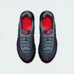 Top-Down View of Pair: Focuses on the Breathe Tech mesh texture and the symmetrical junior-specific lacing system.