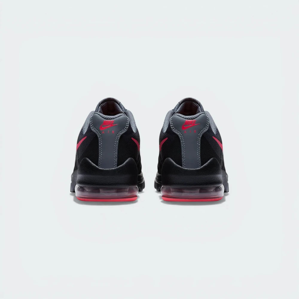 View from Behind Looking at the Heel: Focuses on the "Nike Air" branding and the structured support housing the pink Air unit.