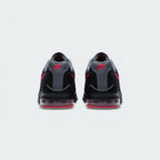 View from Behind Looking at the Heel: Focuses on the "Nike Air" branding and the structured support housing the pink Air unit.