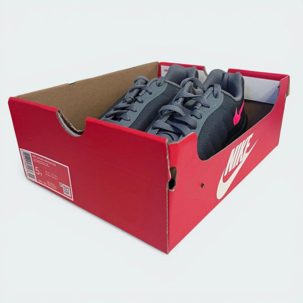 Gray sneakers in a red Nike box on a white background