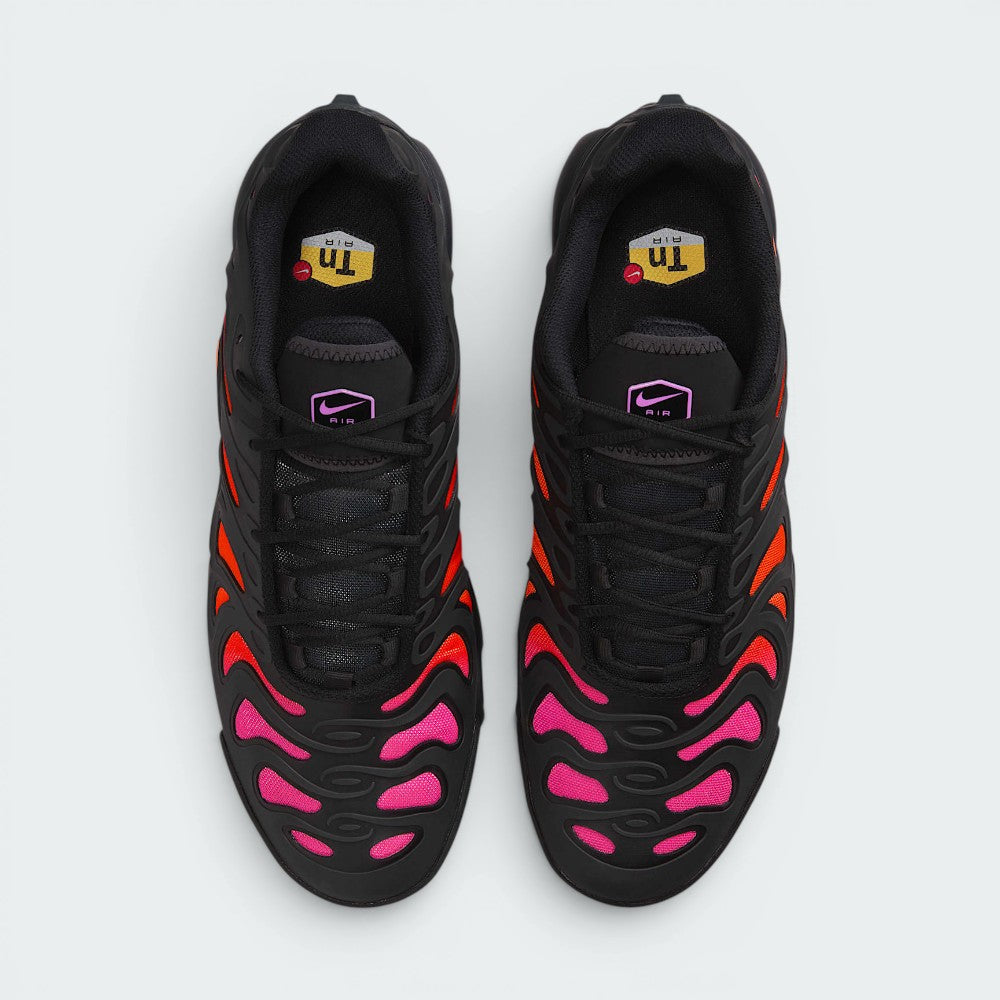 Focuses on the locked-in central lacing layout, displaying the perfect symmetry of the dark textile tongue, the integrated lace loops, and the fiery orange burst framing the front toe box area.