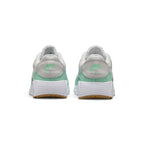Rear-facing perspective focusing on the textured leather heel panel featuring mint Nike Air branding, stacked foam midsole, and the base of the gum outsole.
