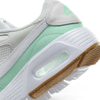 Detailed close-up angle capturing the transparent Max Air cushioning unit housed within the clean white foam midsole sidewall.