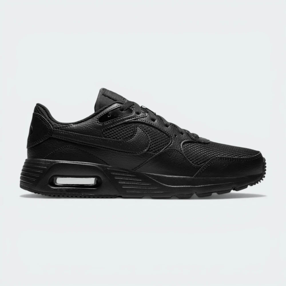 Side Profile Image: The Black Air Max SC, highlighting the bold Black Swoosh and the iconic visible Max Air window in the heel.