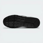 Outsole View: Showing the rubber traction pattern and the integrated flex grooves for natural movement.