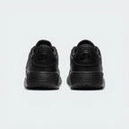 View from Behind Looking at the Heel: Focusing on the embroidered Nike Air branding and the streamlined finish of the foam midsole.