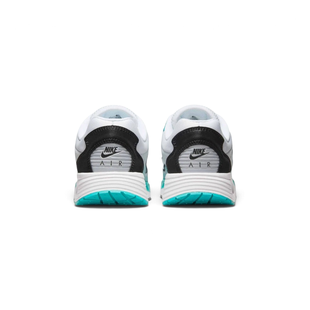 Focuses on the contoured shape of the padded low-cut collar, highlighting the structured heel counter and the clean integration of the visible Air cushioning frame below.
