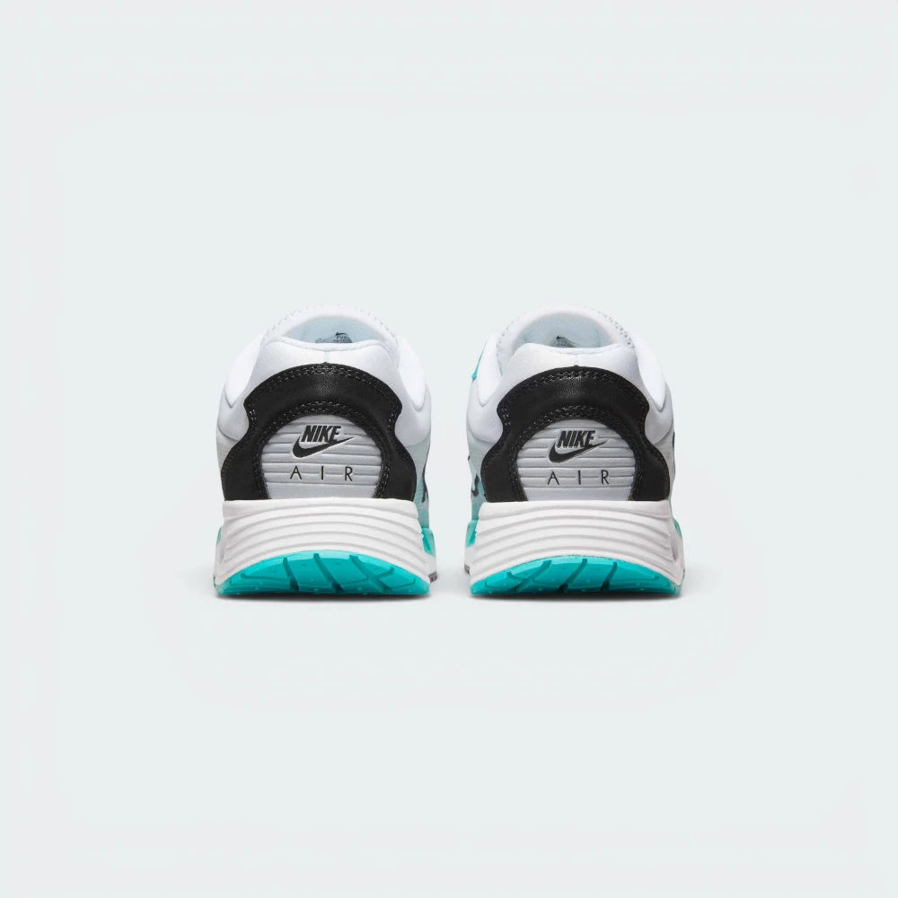 Focuses on the contoured shape of the padded low-cut collar, highlighting the structured heel counter and the clean integration of the visible Air cushioning frame below.