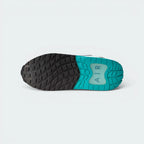 Displays the flat-profile geometric traction pattern of the solid rubber sole, showing the durable grip segments engineered for unreal everyday multi-surface street tracking.
