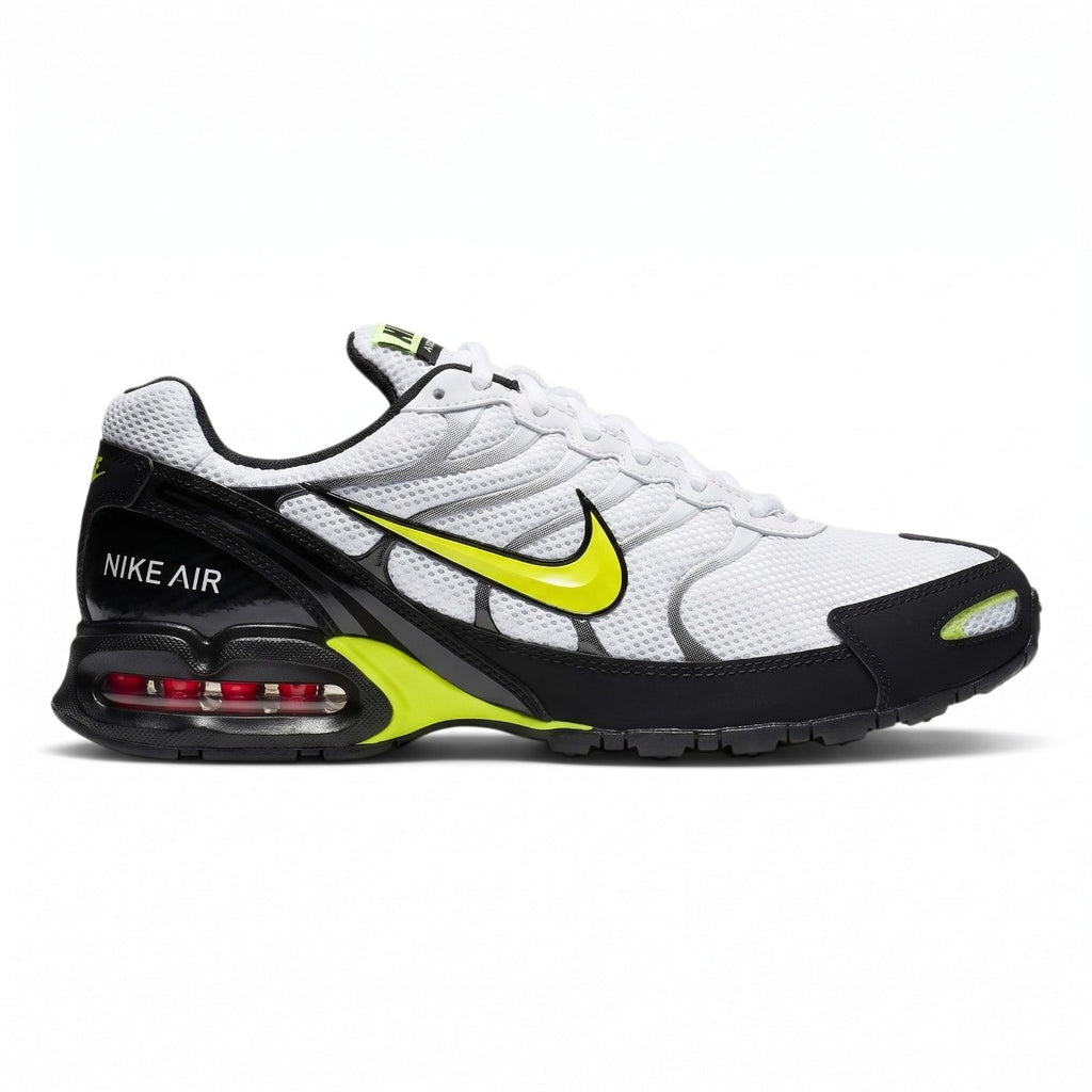 Studio lateral shot of the Nike Air Max Torch 4 men's running trainers in white, volt, and black, highlighting the breathable mesh upper, supportive synthetic overlays, electric volt swoosh branding, and visible Max Air heel cushioning unit.