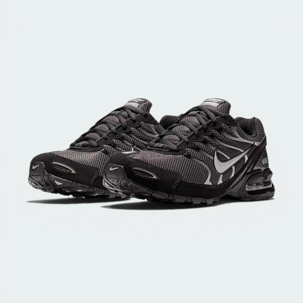 Emphasising the locked-in heel counter and the professional "Metallic Silver" depth.