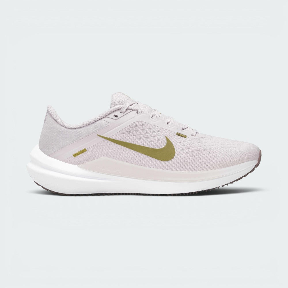 Highlights the high-velocity sweep of the Pacific Moss green Nike Swoosh, showing the professional texture of the Platinum Violet engineered mesh upper, the stitched accent bar, and the crisp white foam midsole wall.