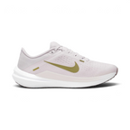 Highlights the high-velocity sweep of the Pacific Moss green Nike Swoosh, showing the professional texture of the Platinum Violet engineered mesh upper, the stitched accent bar, and the crisp white foam midsole wall.