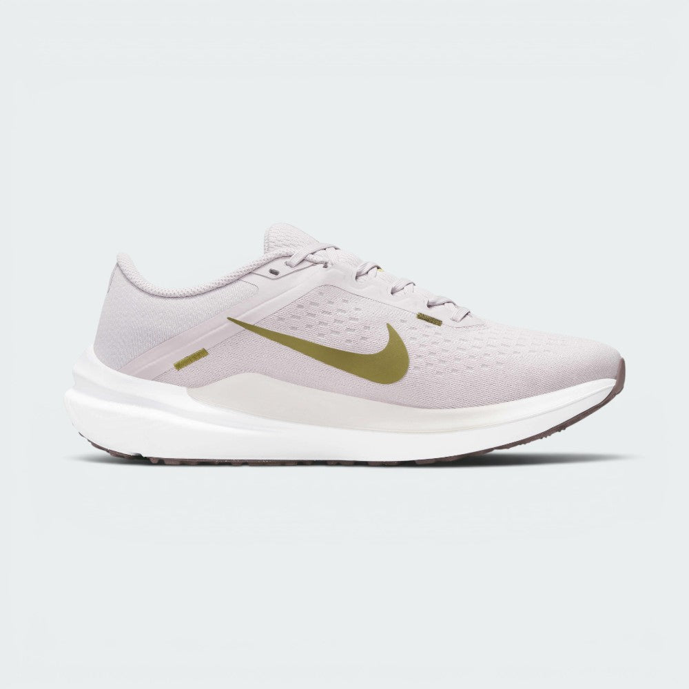Highlights the inner profile of the shoe, displaying the clean line of the Pacific Moss Swoosh, the smooth overlay wrapping the heel base, and the balanced stance of the sole tooling.