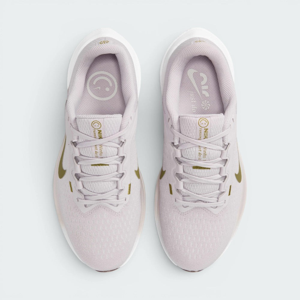Focuses on the locked-in central lacing layout, displaying the perfect symmetry of the Platinum Violet mesh tongue, tonal laces, Pacific Moss "NIKE Winflo 10" text, and the smiley face insole graphics.