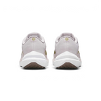 Focuses on the contoured shape of the padded ankle collar, highlighting the central heel seam topped with a circular Pacific Moss Sunburst logo and the wide white foam landing base below.