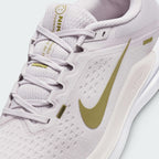 Details the micro-precision of the engineered forefoot mesh, showing the revamped spacious toe box and the neat tracking of the laces through the midfoot eyestays.