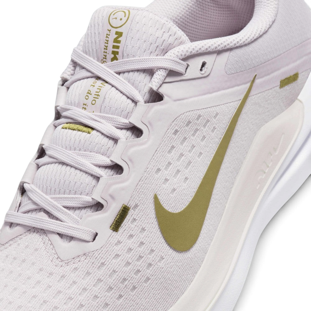 Details the micro-precision of the engineered forefoot mesh, showing the revamped spacious toe box and the neat tracking of the laces through the midfoot eyestays.