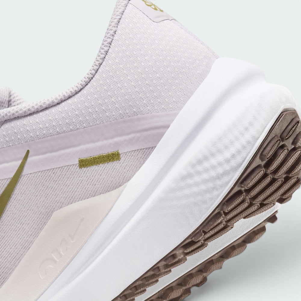 Highlights the "unreal" clean finish where the sculpted white foam midsole meets the debossed heel overlay and the dark brown Waffle rubber tread pods below.