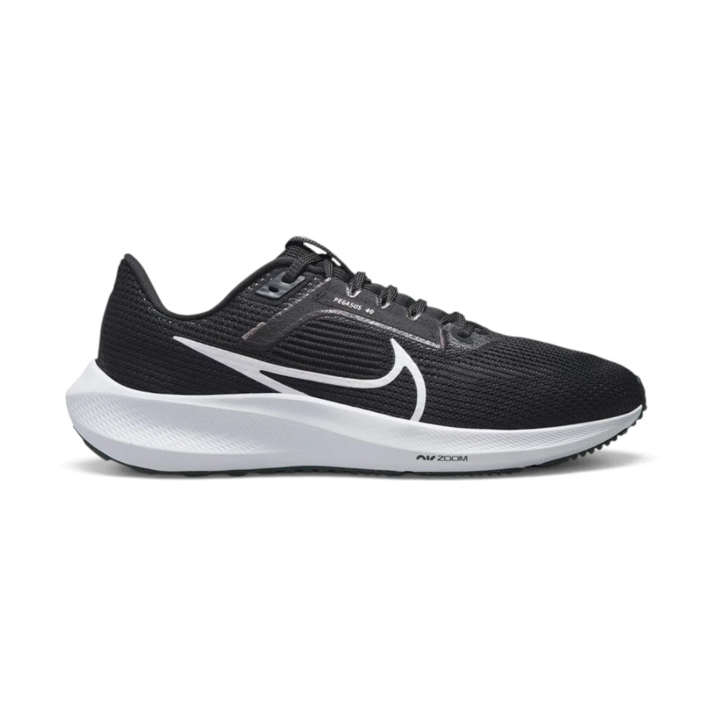 Studio lateral shot of the Nike Women's Air Zoom Pegasus 40 women's running shoes in black and white, highlighting the engineered mesh upper, prominent white Swoosh, supportive midfoot band, and responsive white foam midsole with Air Zoom branding. Main image