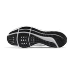 Bottom-down view of the black and white rubber outsole, showcasing the waffle-inspired traction pattern, flex grooves, and arch support bridge.