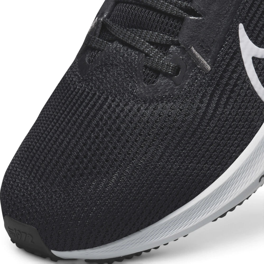 Macro focus on the fine-grained engineered mesh forefoot, synthetic eyestays, and the embossed "1972" detail on the toe bumper.
