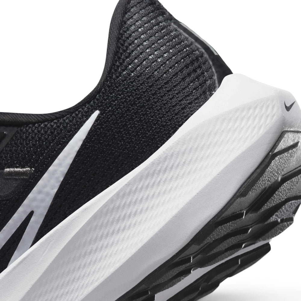 Detailed close-up angle capturing the textured sidewall of the React foam midsole and the smooth transition into the padded heel collar.