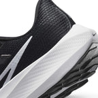 Detailed close-up angle capturing the textured sidewall of the React foam midsole and the smooth transition into the padded heel collar.