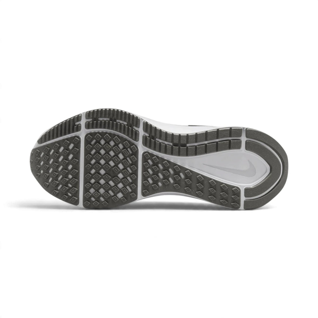 Bottom profile of the running shoe displaying the grey and white multi-surface rubber traction pattern and integrated midfoot stability shank.
