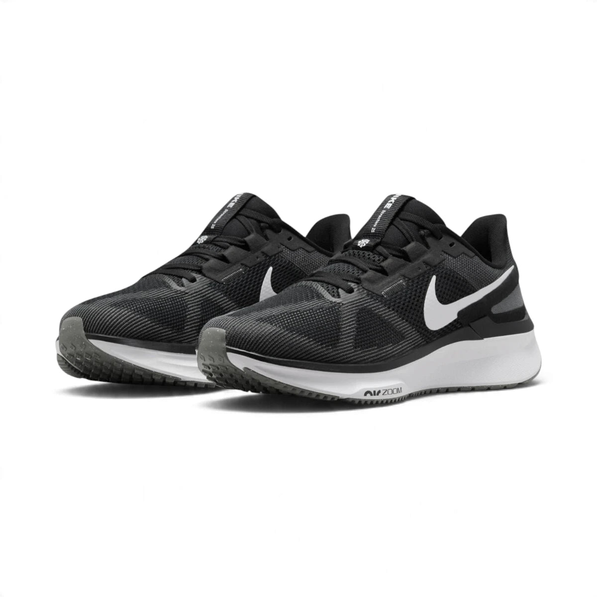 Three-quarter forward angle showcasing both sneakers side by side, highlighting their structured athletic silhouette and clean black-and-white colour blocking.