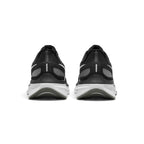  Rear view of the sneakers emphasising the supportive heel counters, reflective vertical stripe details, and curved sole geometry.
