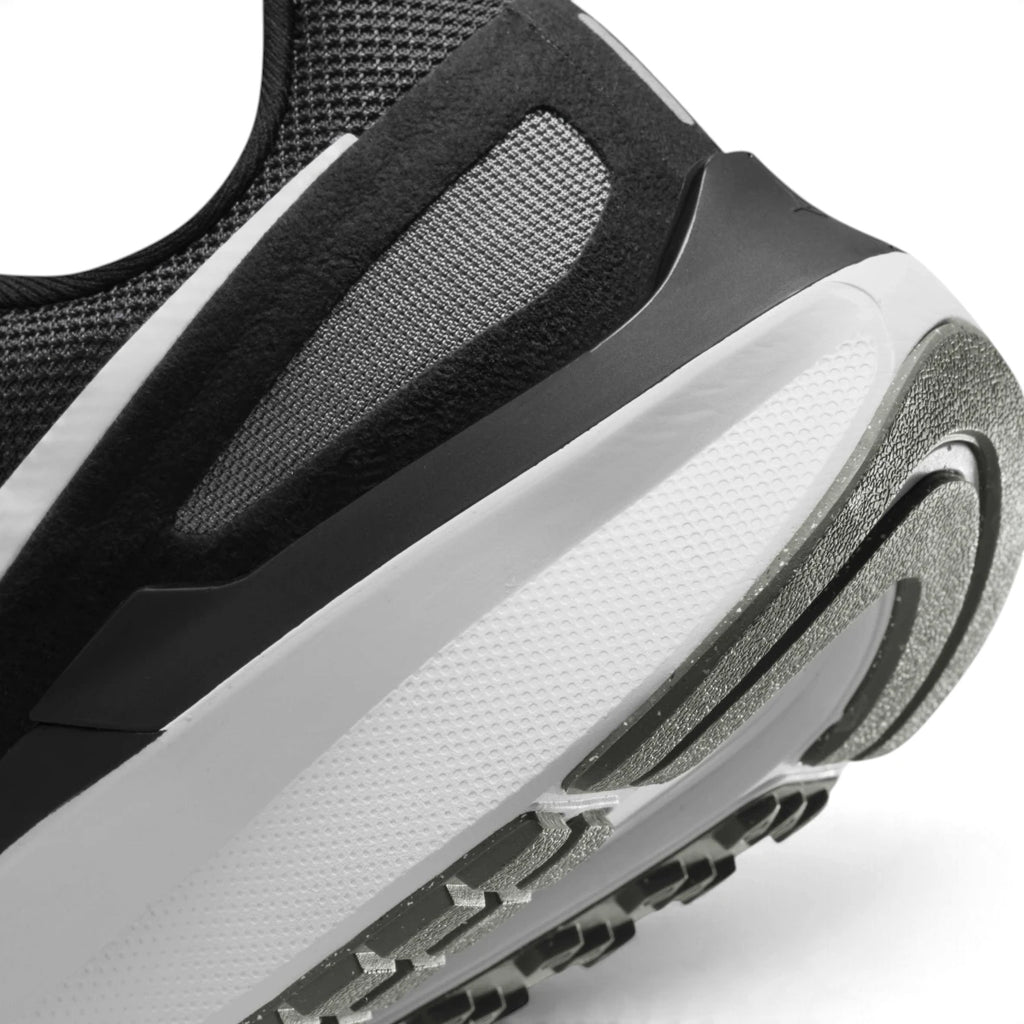 Close-up of the lateral heel transition, highlighting the soft foam midsole contour and durable rubber outsole tread pattern.