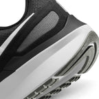 Close-up of the lateral heel transition, highlighting the soft foam midsole contour and durable rubber outsole tread pattern.