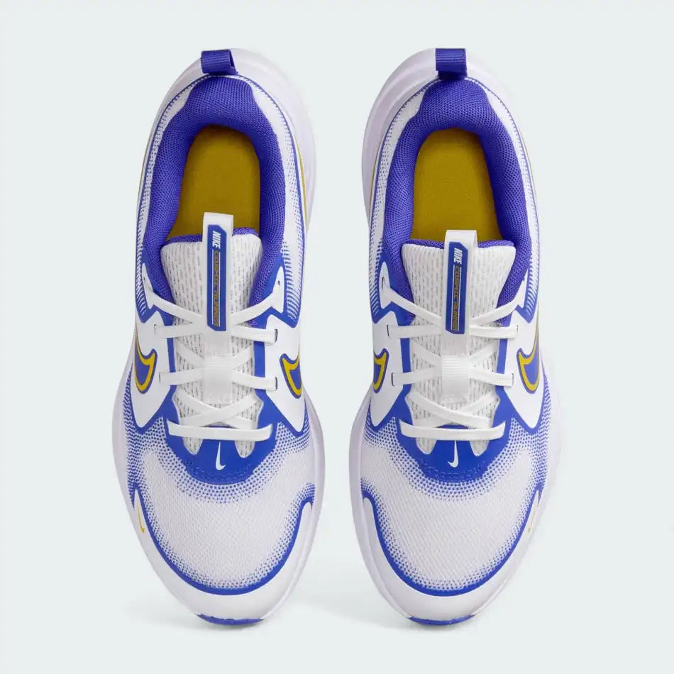 Top-down view of a pair of Nike Cosmic Runner Juniors' running trainers in white and yellow, highlighting their streamlined silhouette and lace-up closure.
