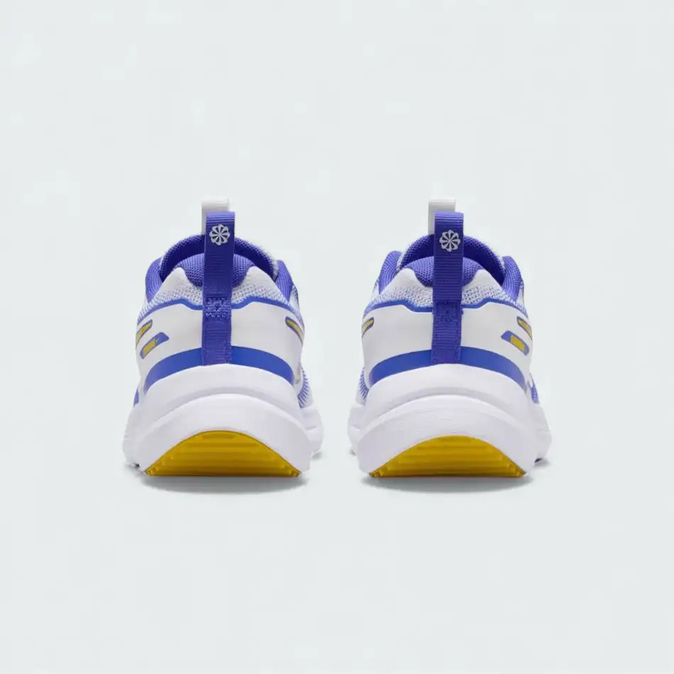 Rear view of the Nike Cosmic Runner Juniors' white running trainers, focusing on the structured heel and subtle branding.