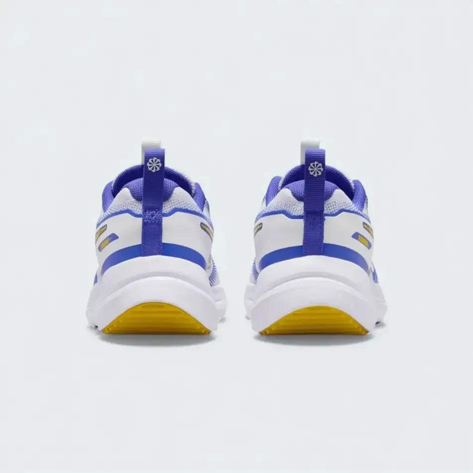 Rear view of the Nike Cosmic Runner Juniors' white running trainers, focusing on the structured heel and subtle branding.