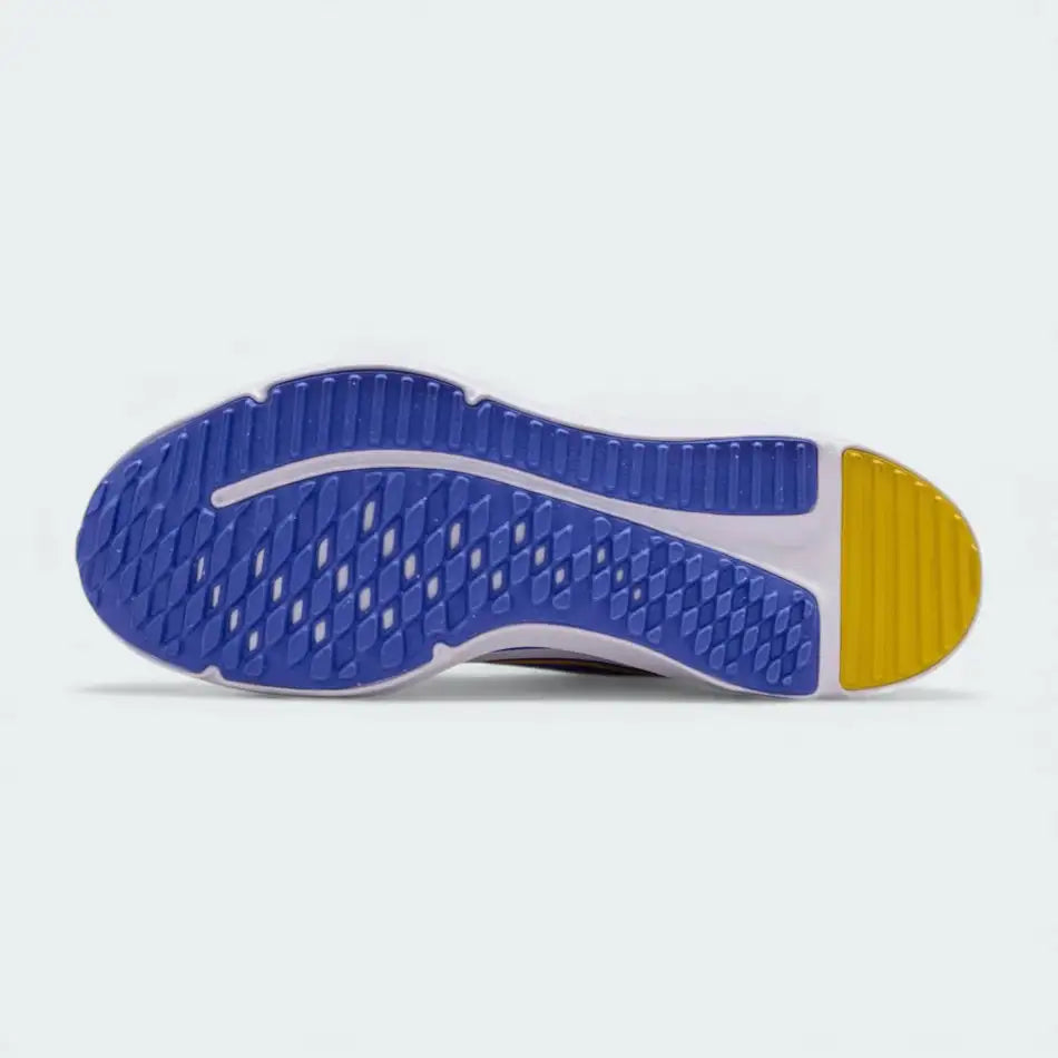 View of the outsole of the Nike Cosmic Runner Juniors' white running trainers, showing the durable rubber tread pattern for multi-surface traction.