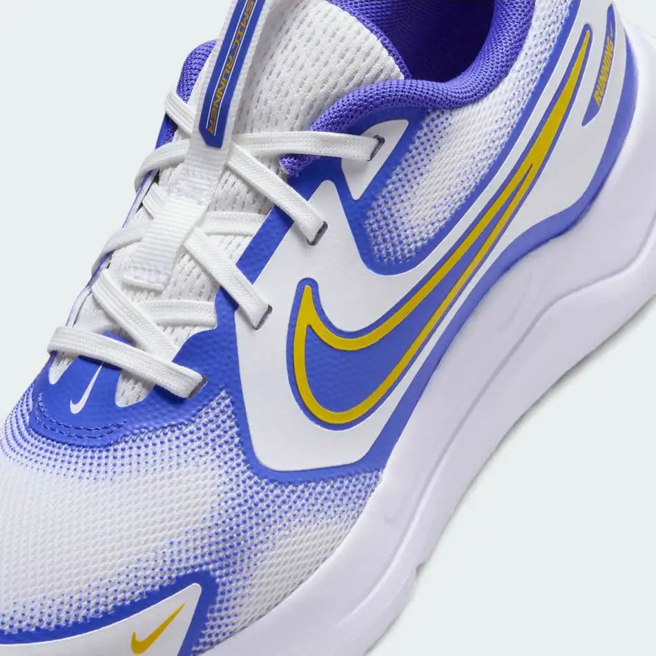 Close-up zoom on the front of the Nike Cosmic Runner Juniors' white running trainers, showing the mesh upper texture, lacing system, and synthetic overlays.