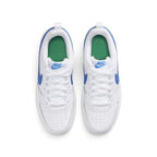 Focuses on the locked-in central lacing layout, displaying the crisp white laces, padded mesh tongue with blue printed Nike logo badge, cushioned Stadium Green insoles, and white heel pull tabs.