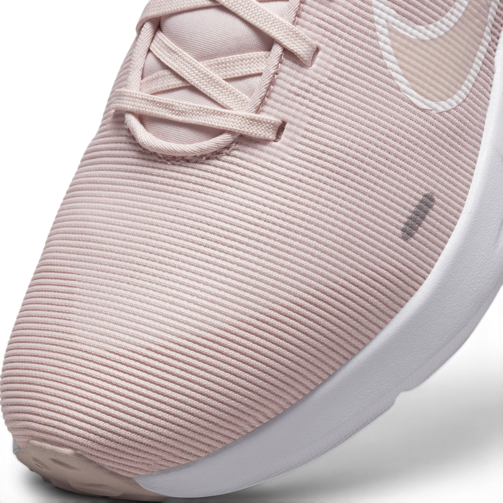 Details the micro-precision of the horizontal ribbed mesh upper, showing the reinforced toe cap seam and neat lace tracking.