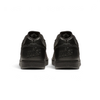 Focuses on the debossed Nike branding and the professional finish of the heel construction.