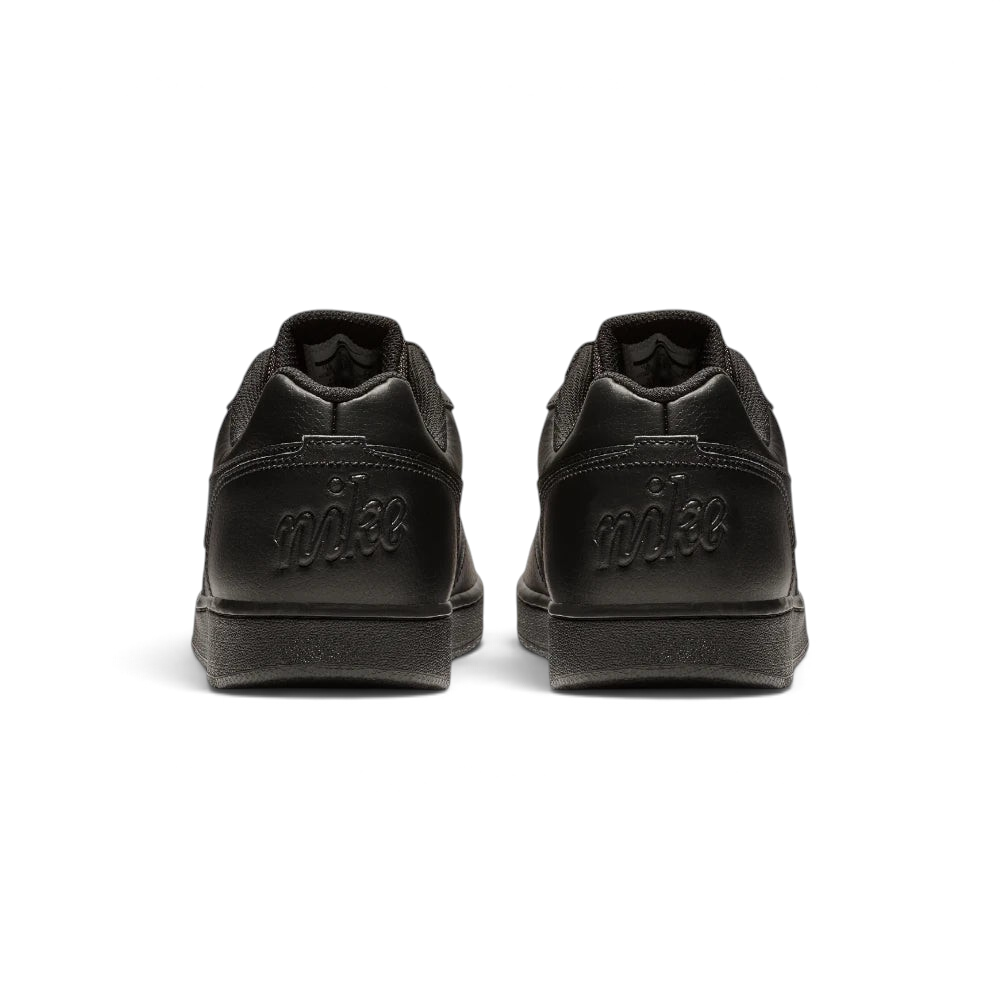 Focuses on the debossed Nike branding and the professional finish of the heel construction.
