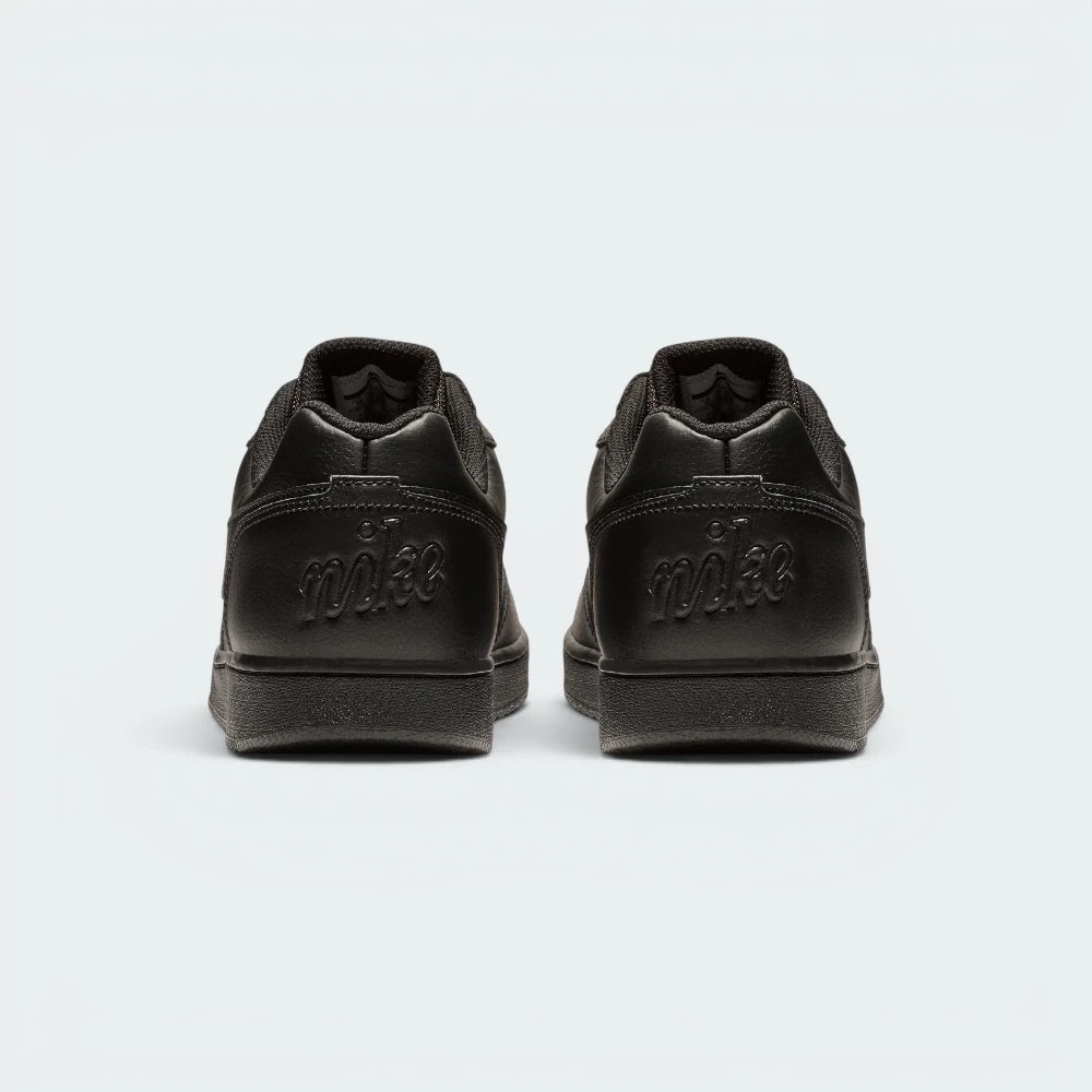 Focuses on the debossed Nike branding and the professional finish of the heel construction.