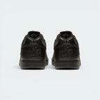 Focuses on the debossed Nike branding and the professional finish of the heel construction.