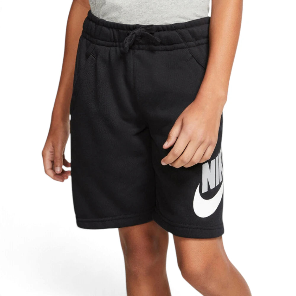 Front-on view of a young model wearing the black jersey shorts paired with a grey t-shirt, highlighting the comfortable mid-thigh fit.